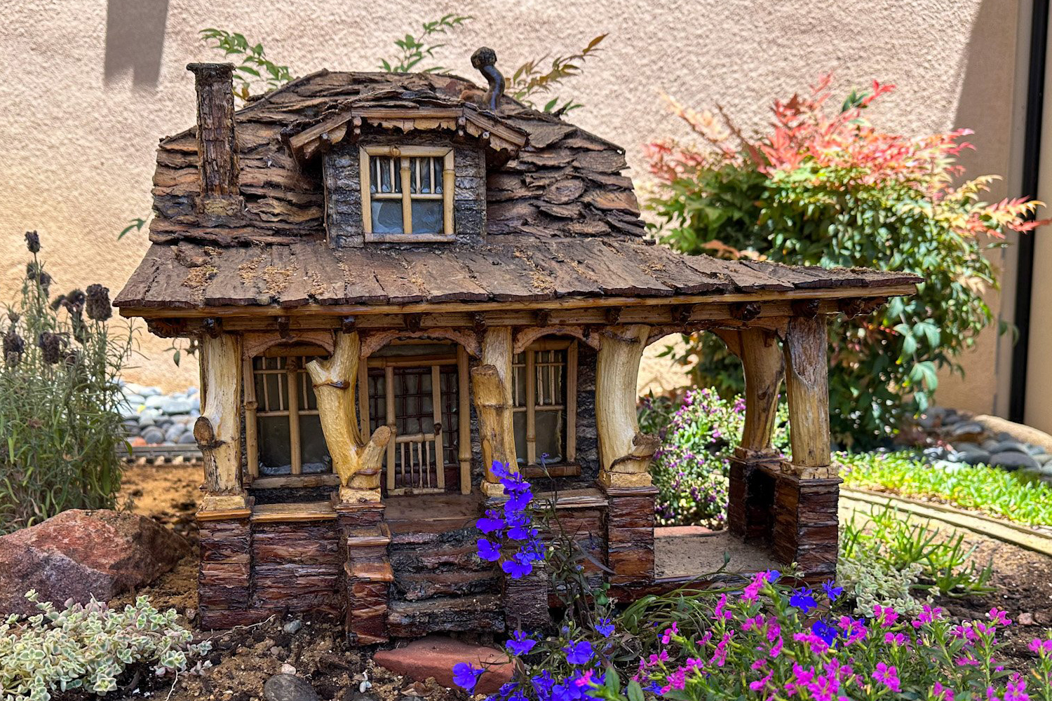 Freight and Flora: A Garden Railroad building, flowers and track. Freight and Flora: A Garden Railroad building, flowers and track.